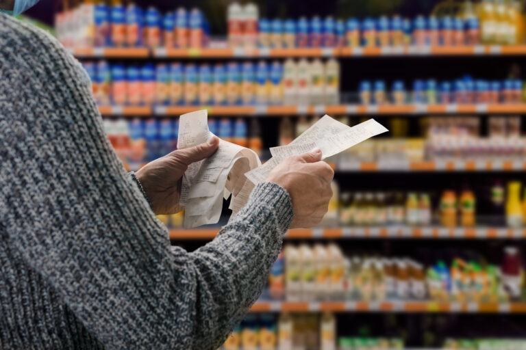 Shopper checking receipts in a supermarket