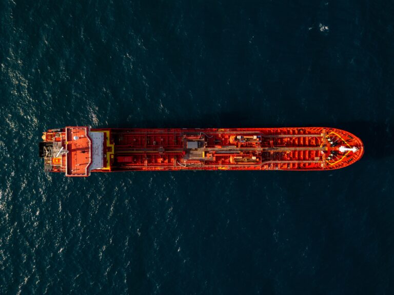 An aerial view of a loaded crude oil tanker at sea, reflecting disruption to Gulf shipping and rising oil prices."